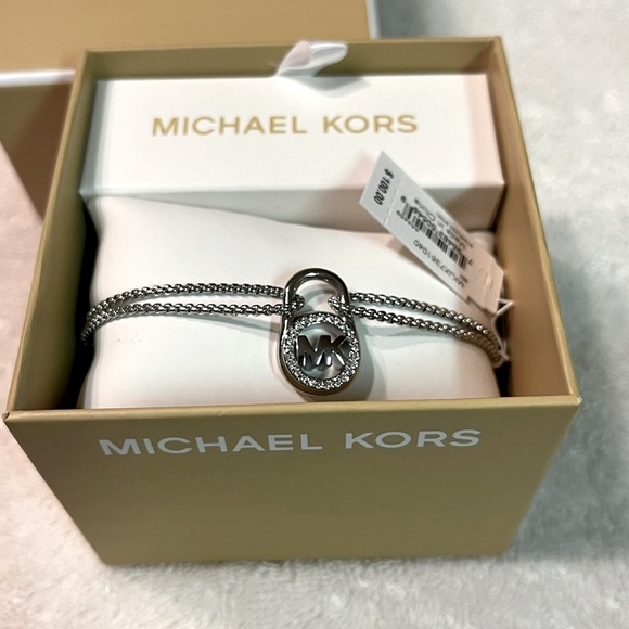 Michael Kors Jewelry - NEW Michael Kors adjustable bracelet. Silver tone. Box included. Perfect gift